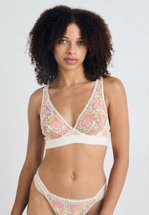 Bralette en dentelle avec des motifs floraux brodés dans des couleurs pastel, comportant une bande sous poitrine douce en crème et un slip taille basse assorti.