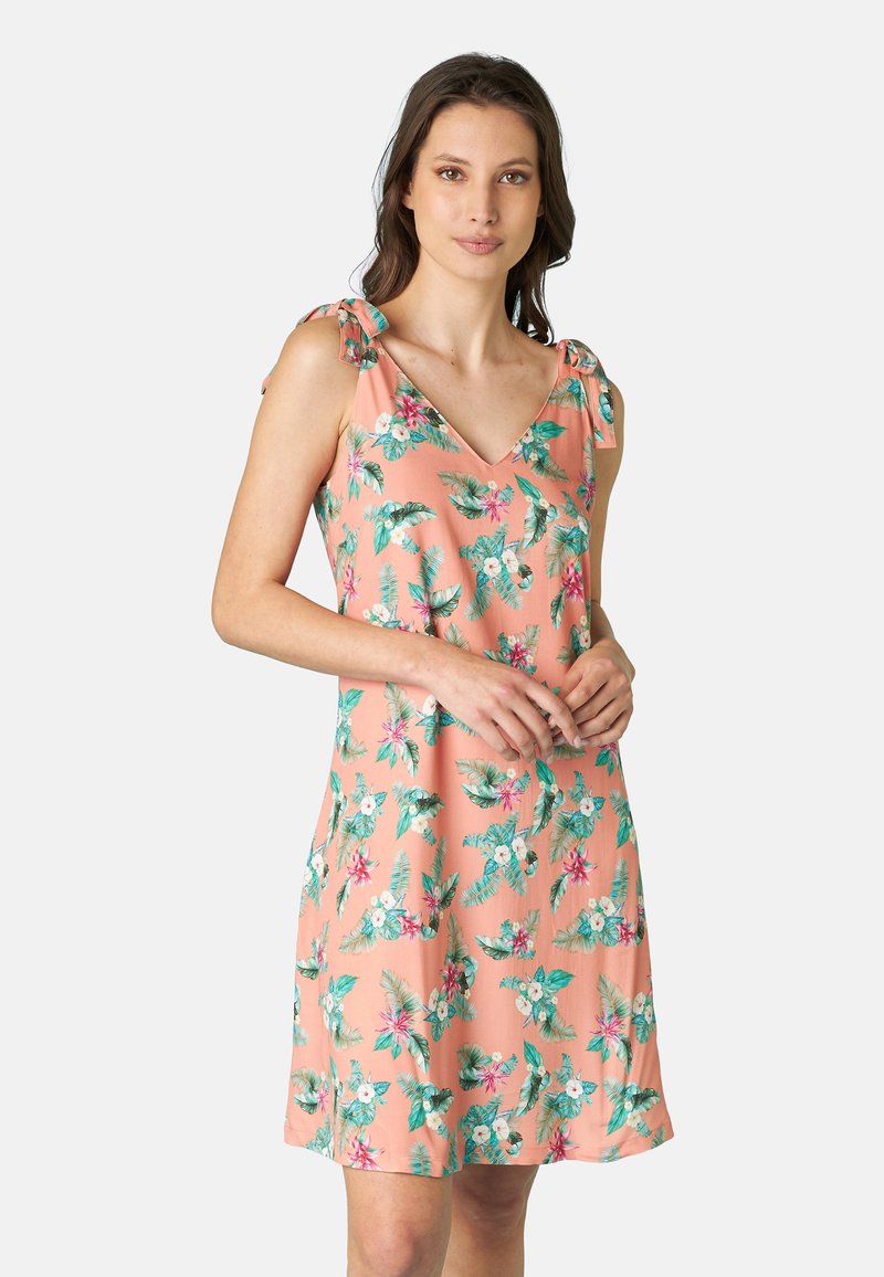 Abito floreale pesco realizzato in tessuto leggero con scollo a V e spalline, decorato con foglie verdi e fiori rosa.