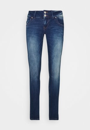 Jeans skinny in denim blu scuro con chiusura a due bottoni, tasche frontali e dettagli di fading sottili sul tessuto, che offrono una silhouette elegante.