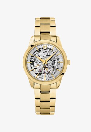 Zlatni metalni ručni sat s vidljivim složenim mehaničkim zupčanicima, zlatnim oznakama sati i trima zlatnim kazaljkama koje pokazuju vrijeme 10:10:38.