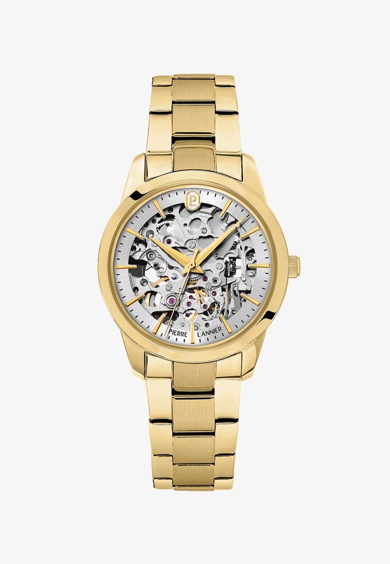 Zlaté kovové náramkové hodinky s viditelnými složitými mechanickými soukolími, zlatými hodinovými značkami a třemi zlatými ručičkami ukazujícími čas 10:10:38.