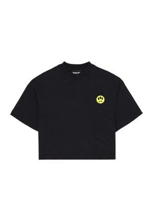 T-shirt nera corta a maniche corte con scollo tondo e piccolo logo giallo di faccia sorridente con zanne sul petto a sinistra.