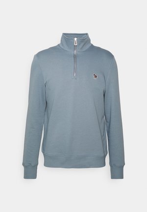 Light blue pullover sweatshirt with a high collar and a quarter zipper. Features ribbed cuffs and a small embroidered logo on the left chest.