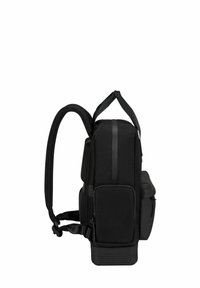 Black backpack with padded straps, side pocket, rectangular shape, textured fabric, and a top zipper closure.