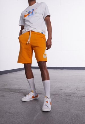 Pantalones deportivos - mustard yellow