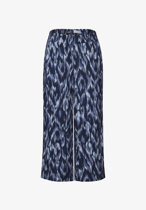 Navy siniset culotte-housut, joissa on abstrakti vaaleansininen ja harmaa kuvio, joustava vyötärö, pehmeä kangas ja polven puoliväliin ulottuva pituus.