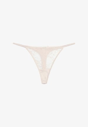 Lace thong in soft beige, featuring floral patterns with satin accents, thin straps, and a low-rise design.