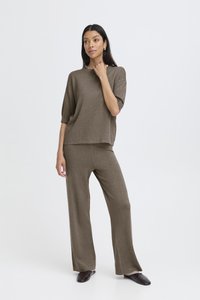 Khaki two-piece outfit made of soft fabric featuring a loose-fitting top with short sleeves and wide-leg pants. Smooth texture, minimal design.