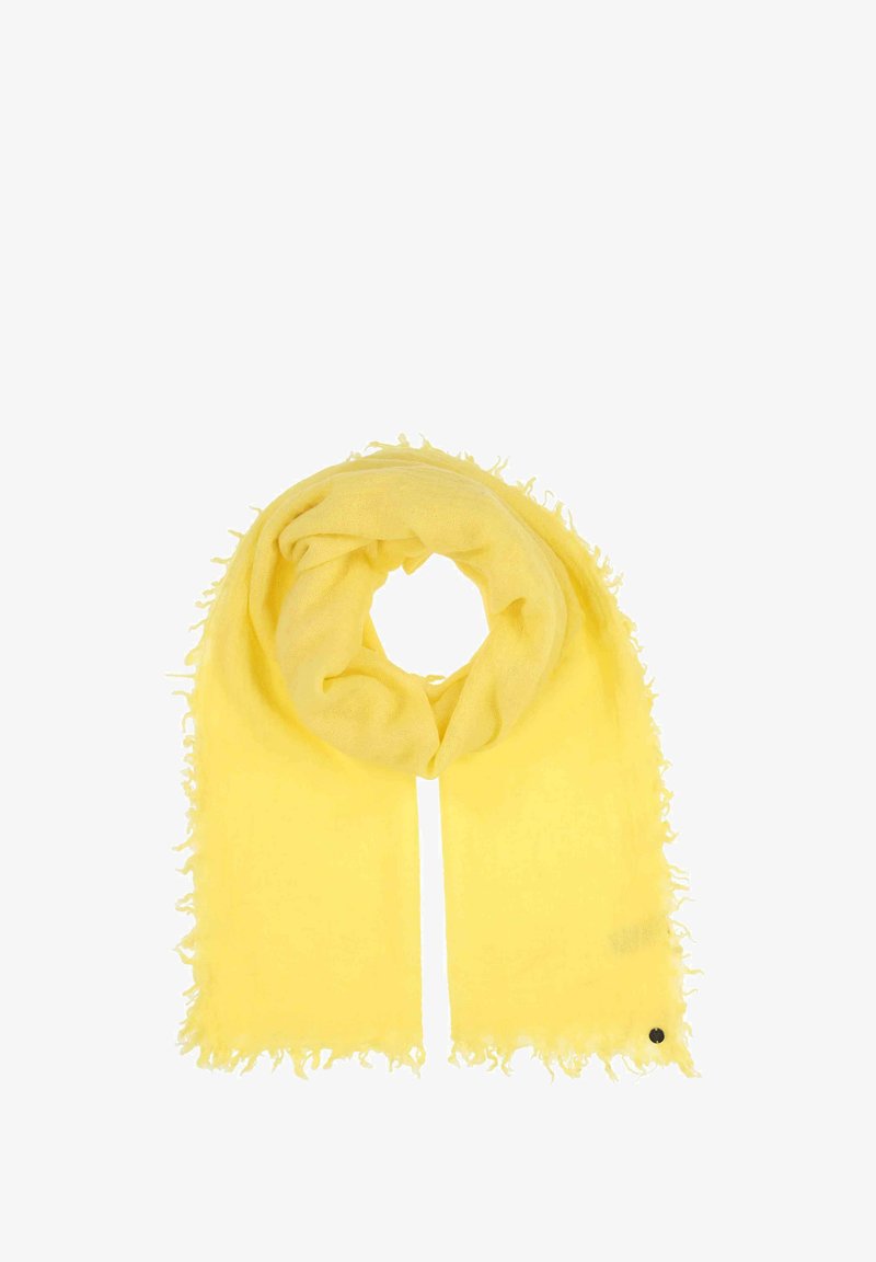 Kollane sall pehmest kangast, millel on friteeritud äär ja ümmargune must aktsentdetail. Kantud ringikujuliselt.