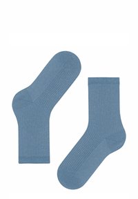 Blaue gerippte Socken aus einem weichen Material, mit einem dezenten Glanz, in traditioneller Knöchelhöhe und mit einer strukturierten Verarbeitung für zusätzlichen Komfort.