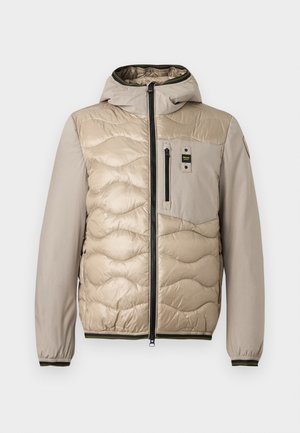 Beige puffer jacket with a quilted pattern, hood, and zippered front. Features a chest pocket and ribbed cuffs with contrasting trim.