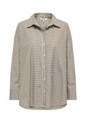 Chemise à manches longues avec motif à carreaux marron et blanc et col pointu, étiquetée "ONLY" à l'intérieur du col.