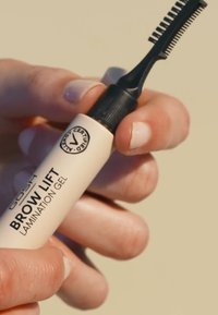 Brow Lift Lamination Gel i en ljus beige tub med svart lock och kamapplikator, med en certifierad logotyp på etiketten.