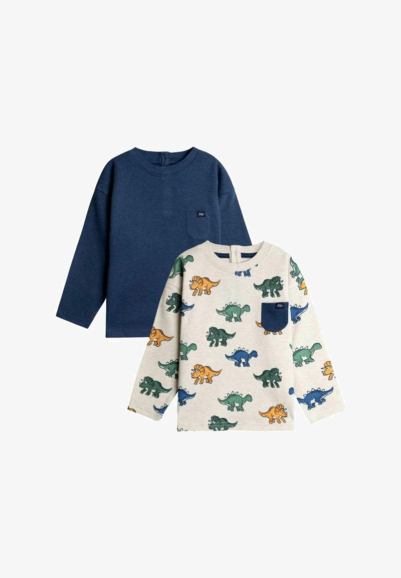 Két hosszúujjú kisfiú ing, az egyik sötétkék, mellzsebes, a másik bézs, színes dinoszauruszos mintával és sötétkék zsebbel, mindkettő hátul gombos.