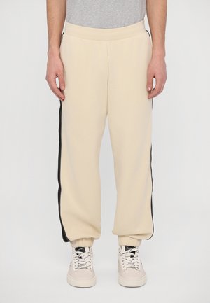 TROUSER - Tracksuit bottoms - almond milk