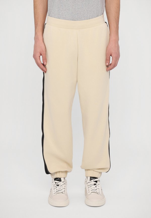 TROUSER - Tracksuit bottoms - almond milk