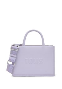Borsa a mano in pelle lavanda con logo "TOUS" in rilievo, doppi manici superiori e tracolla removibile con motivo a logo ripetuto.