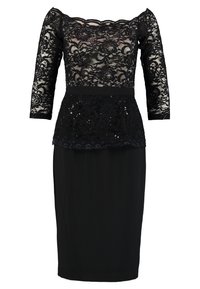 Robe en dentelle noire avec un design décolleté, des manches trois-quarts et une jupe ajustée avec un superposé en dentelle peplum et des sequins.
