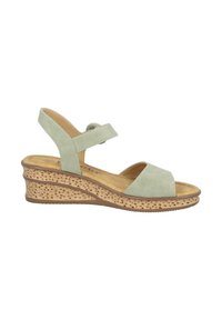 Sandali con tacco a cuneo in suede verde, con fasce sulle dita e cinturino alla caviglia regolabile. Tacco in sughero perforato simile al sughero con suola marrone.