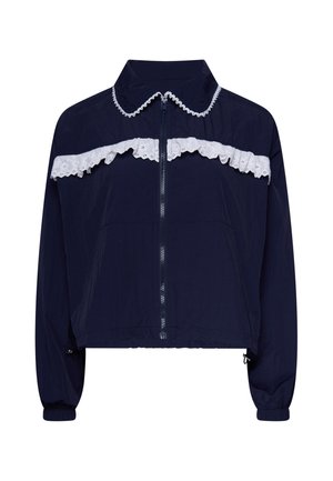 Navy blue zip-up jacket with long sleeves and white lace trim along the collar and chest in a ruffled design.