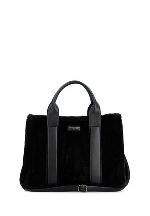 Black handbag with soft fur texture, two smooth leather handles, and a small rectangular metal logo plaque on the front center.