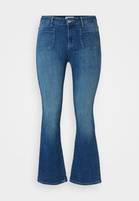 Siniset farkut, joissa on levenevät lahkeet, keski-korkea vyötärö, etu- ja takataskut, sekä sileä pinta ja hieman haalistunut viimeistely.