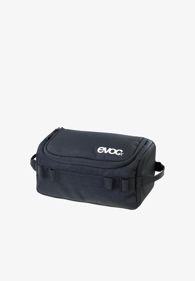 Borsa rettangolare nera in tessuto resistente, dotata di chiusura a zip, maniglia laterale e cinghia frontale per fissaggio. Logo in evidenza.