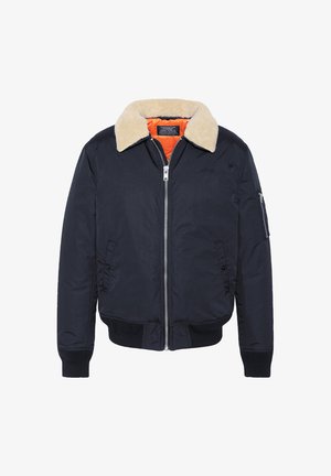 Marineblauwe bomberjack met een beige faux shearling kraag, ritssluiting, elastische manchetten en een oranje voering. Heeft een zijzak.