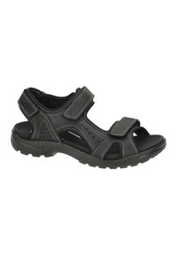 Black sandal featuring adjustable velcro straps, perforated design, cushioned footbed, and rugged rubber sole for traction.