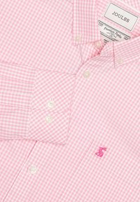 Camicia a maniche lunghe con bottoni rosa e bianchi a quadretti, collo con bottoni e piccolo logo ricamato di lepre rosa sul petto.
