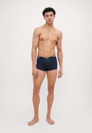 Boxers pour hommes bleu marine avec un design ajusté, dotés d'une ceinture élastique marquée et d'une texture lisse.