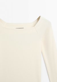 Cream-colored ribbed fabric top with a wide square neckline and long sleeves shown on a white background.