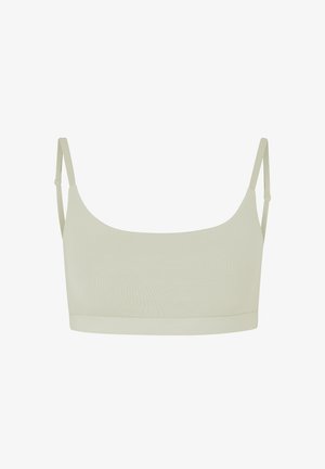 Bralette beige clair avec des fines bretelles réglables, texture lisse et une large bande, présentant un design simple sans embellissements.