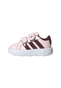 Sneakers per bambini rosa con pois bianchi, strisce bordeaux, doppie cinghie in velcro e una suola bianca con dettagli testurizzati.