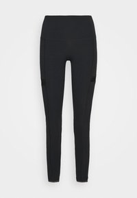 Mustat legginssit, jotka on valmistettu joustavasta kankaasta. Niissä on korkea vyötärö, siv pocketsit mustilla verkko-osiolla ja näkyviä tikkejä.