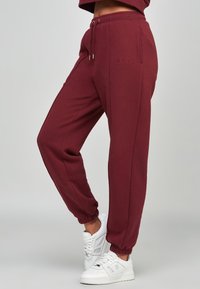 SIKSILK Pantaloni sportivi - red