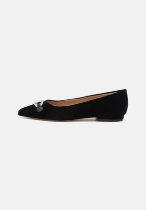 Black suede ballet flats with a pointed toe and a decorative silver buckle. Low, solid black heel and smooth inner lining.