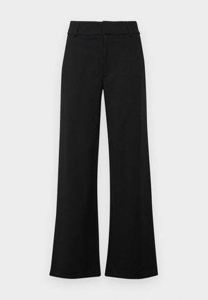 Pantalons larges noirs avec une texture lisse, présentant un devant plat, des passants de ceinture et sans poches visibles. Design épuré et minimaliste.