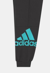 adidas Performance UNISEX - Jogginghose - black/semi mint rush