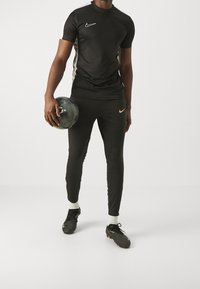 Nike Performance Träningsbyxor - black
