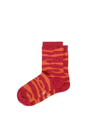 Par de calcetines rojos con patrón de rayas de tigre naranja brillante, puños acanalados y texto antideslizante en las suelas.