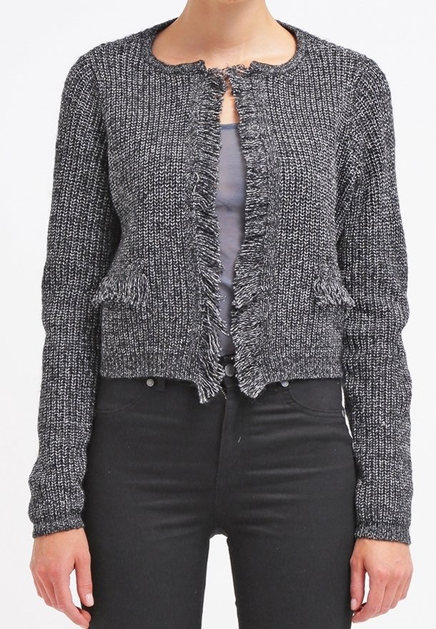 Gray textured cardigan with a round neck, frayed edges, and open front. Worn over a gray top with black fitted pants.