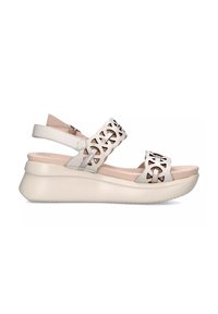 Sandalias de cuero blanco con diseño cortado, correa ajustable y plantilla ligeramente acolchada. Suela de cuña gruesa y suave color crema para mayor comodidad.