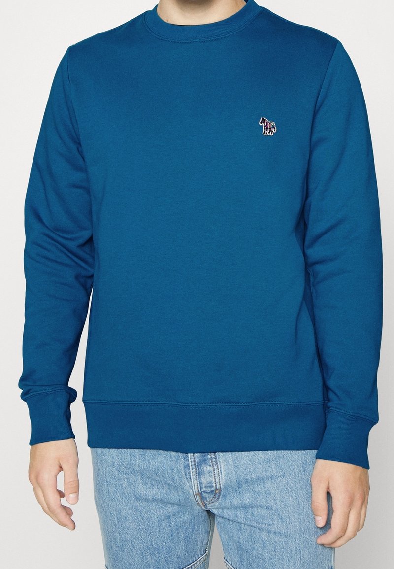 Blauwe crewneck sweatshirt van glad katoen, met lange mouwen en een klein geborduurd paardenlogo op de borst.