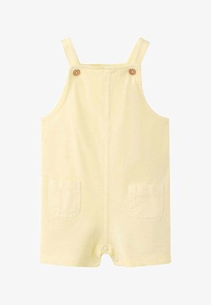Barboteuse bébé jaune crème avec bretelles, boutons en bois, deux poches à l'avant et fermetures à pression à l'entrejambe.