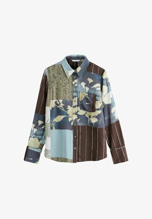 Long-sleeve button-up shirt featuring a patchwork design of floral and abstract patterns in blue, brown, and green tones with a chest pocket.