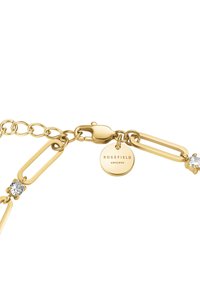 Pulsera de cadena de oro con un cierre, eslabones decorativos y un pequeño acento de diamante. Etiqueta grabada con "ROSEFIELD AM|NYC".