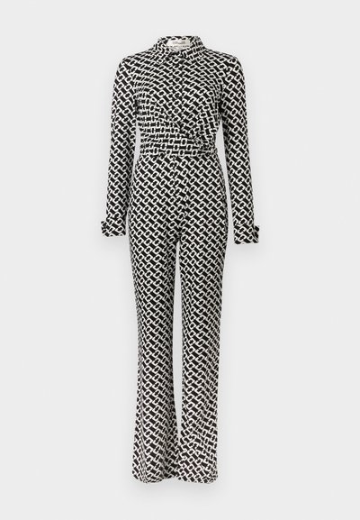 Ολόσωμη φόρμα σε ασπρόμαυρο μοτίβο με μακριά μανίκια, γιακά και φαρδιά πόδια. Διαθέτει στριφτό λεπτομέρεια στη μέση.
