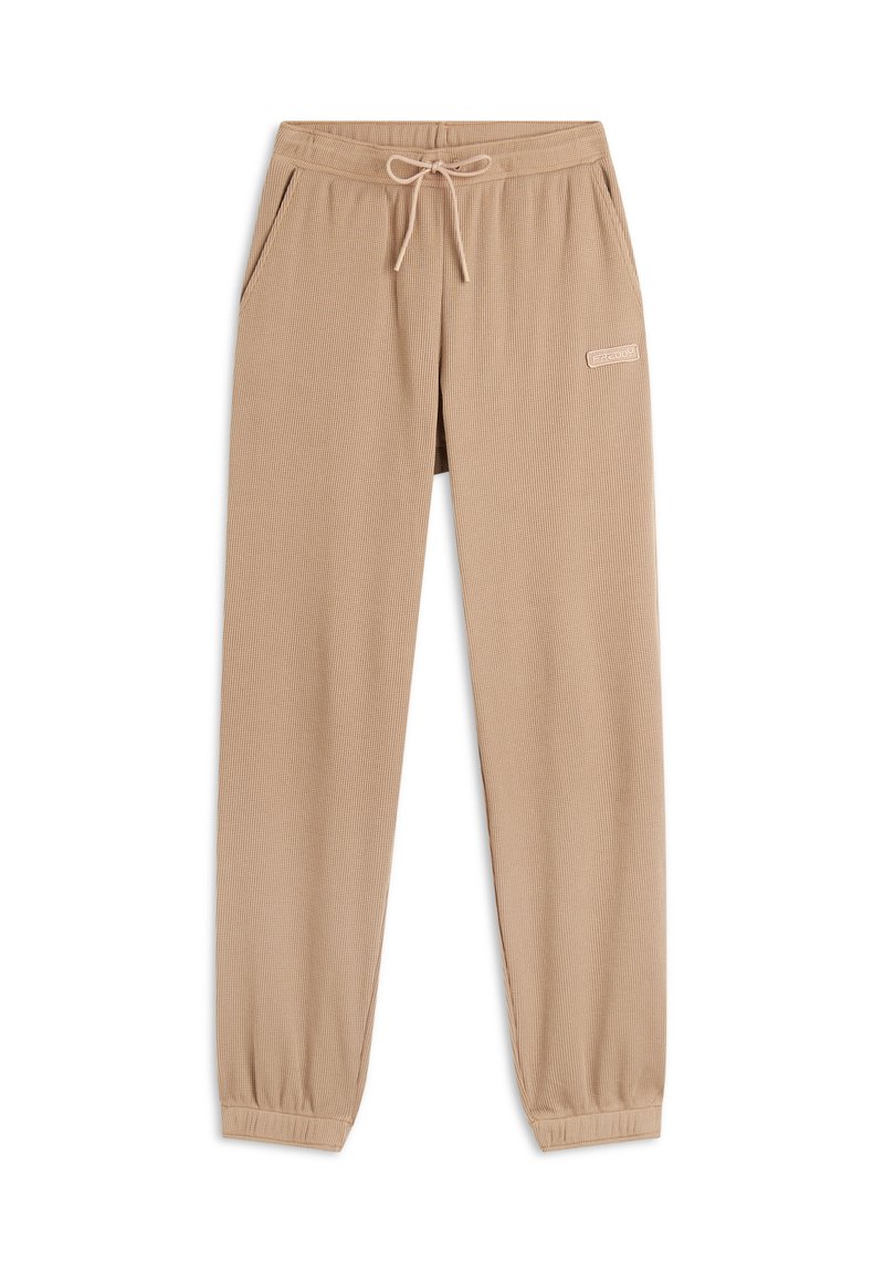 Jogging in beige realizzati in tessuto testurizzato, con una vita elastica, chiusura con cordino e tasche laterali. Presentano un piccolo dettaglio con logo.