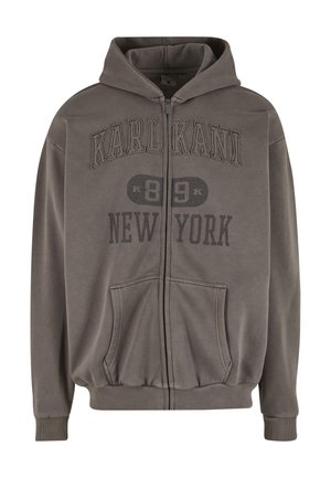 Sweat à capuche gris avec fermeture éclair, fabriqué en tissu doux, doté d'une poche kangourou, de poignets côtelés et d'un texte graphique sur la poitrine : "KARL KANI 89 NEW YORK."
